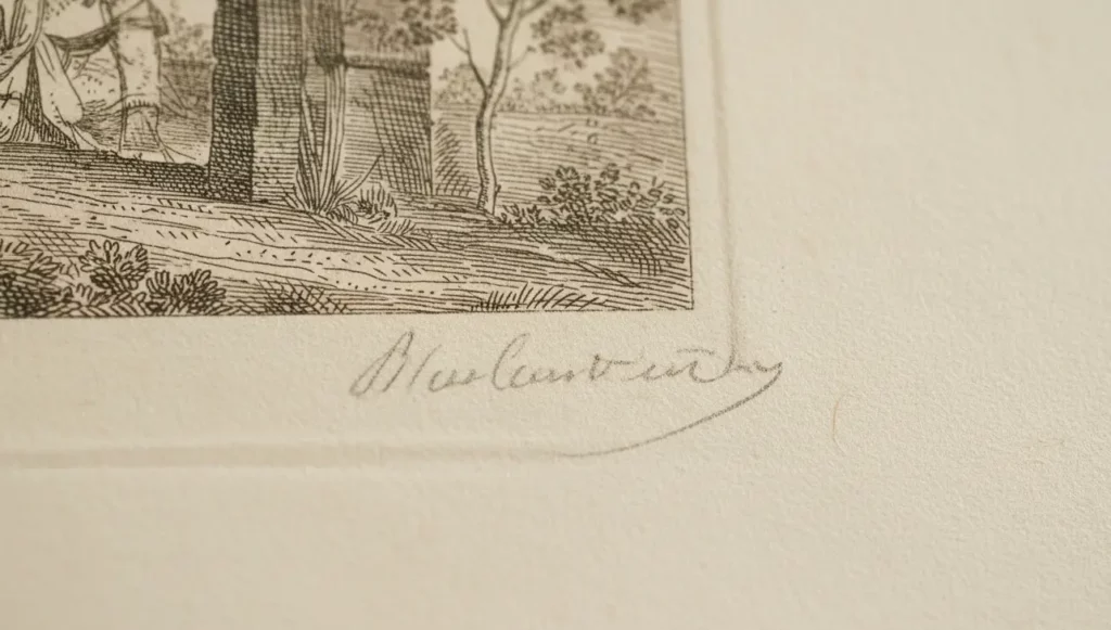 Gros plan sur la signature au crayon et le grain d'une lithographie originale